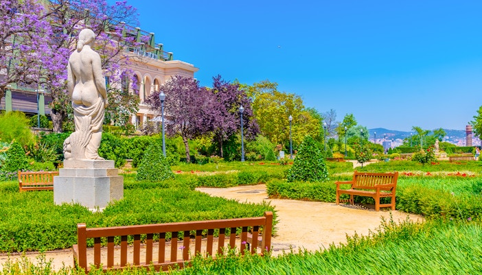 Jardins del Mirador overlooking Barcelona cityscape with distant Sagrada Familia.