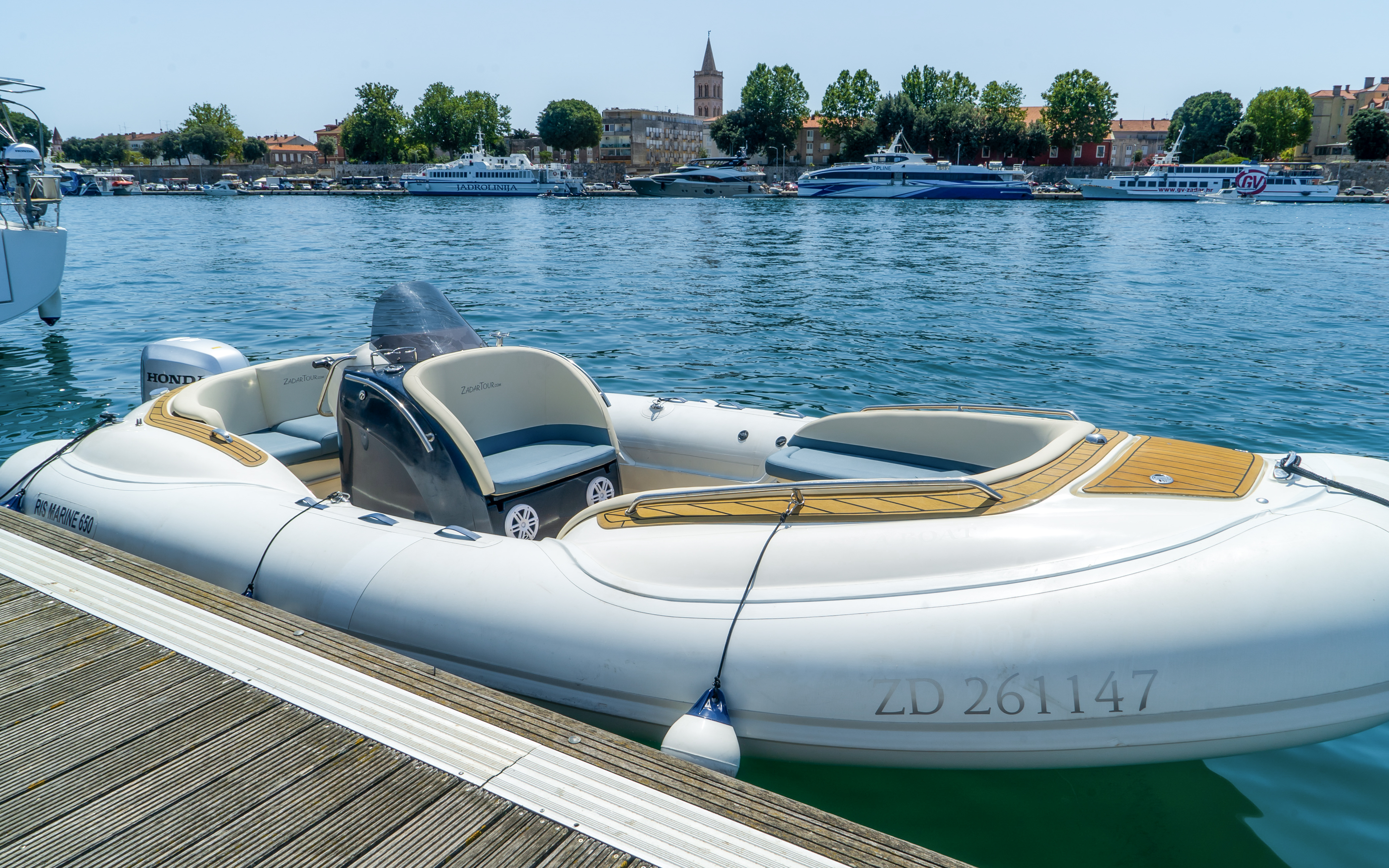 Speedboat docked in Zadar harbor, Croatia, ready for guided tour with local food and wine tasting.