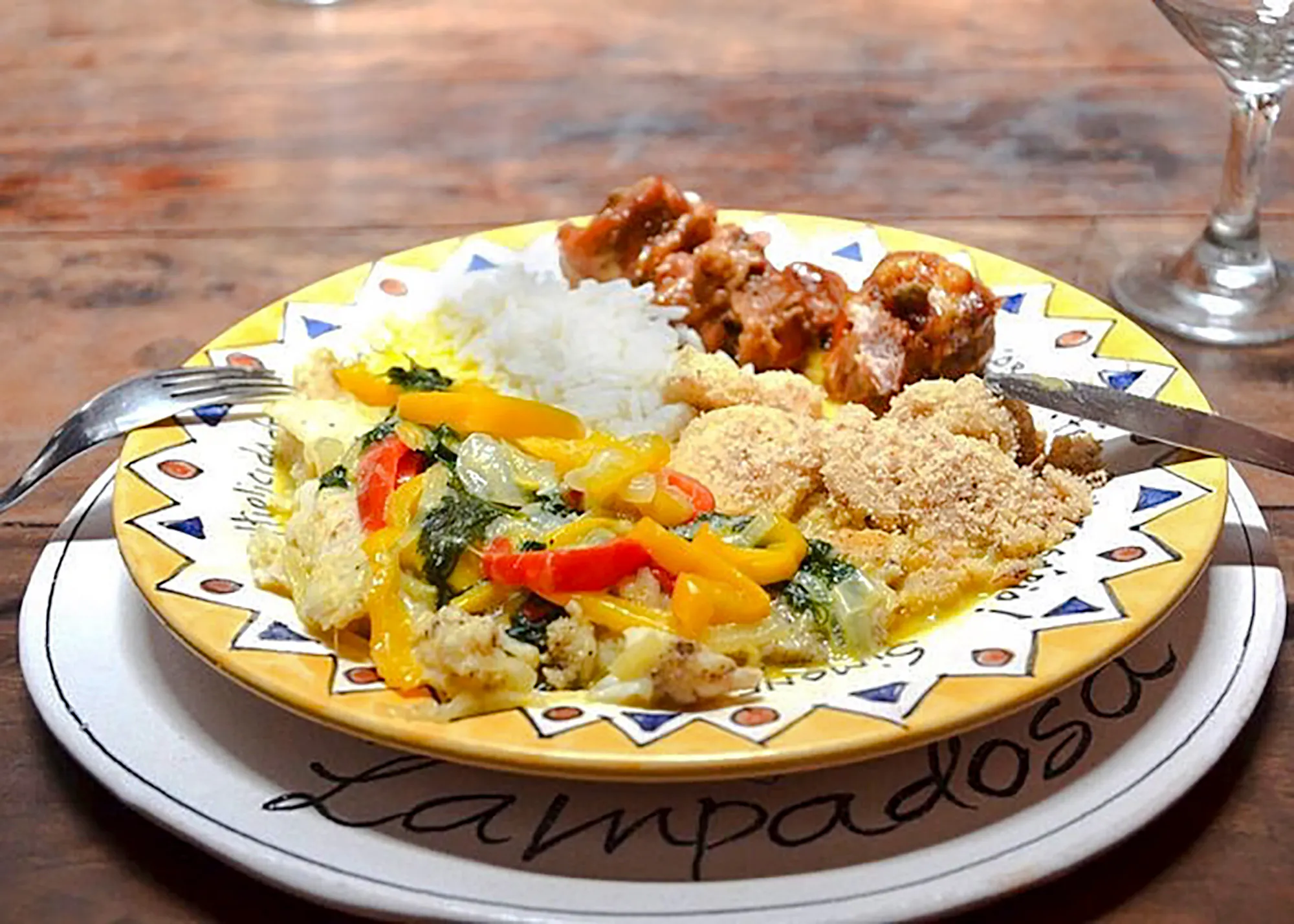 Traditional Brazilian dish with rice, vegetables, and meat served in a Copacabana cooking class, Rio de Janeiro.
