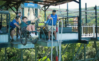 Visitor in wheelchair bungee jumping at Skypark Cairns.