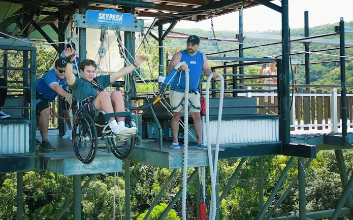 Visitor in wheelchair bungee jumping at Skypark Cairns.