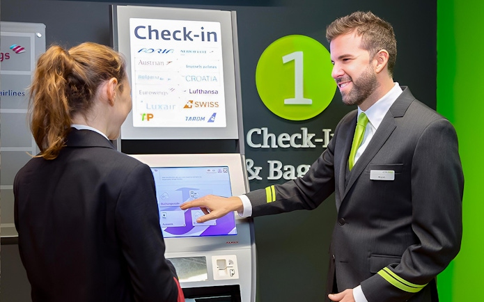 Check-in kiosk at Vienna Airport for City Airport Train tickets to Wien Mitte Station.