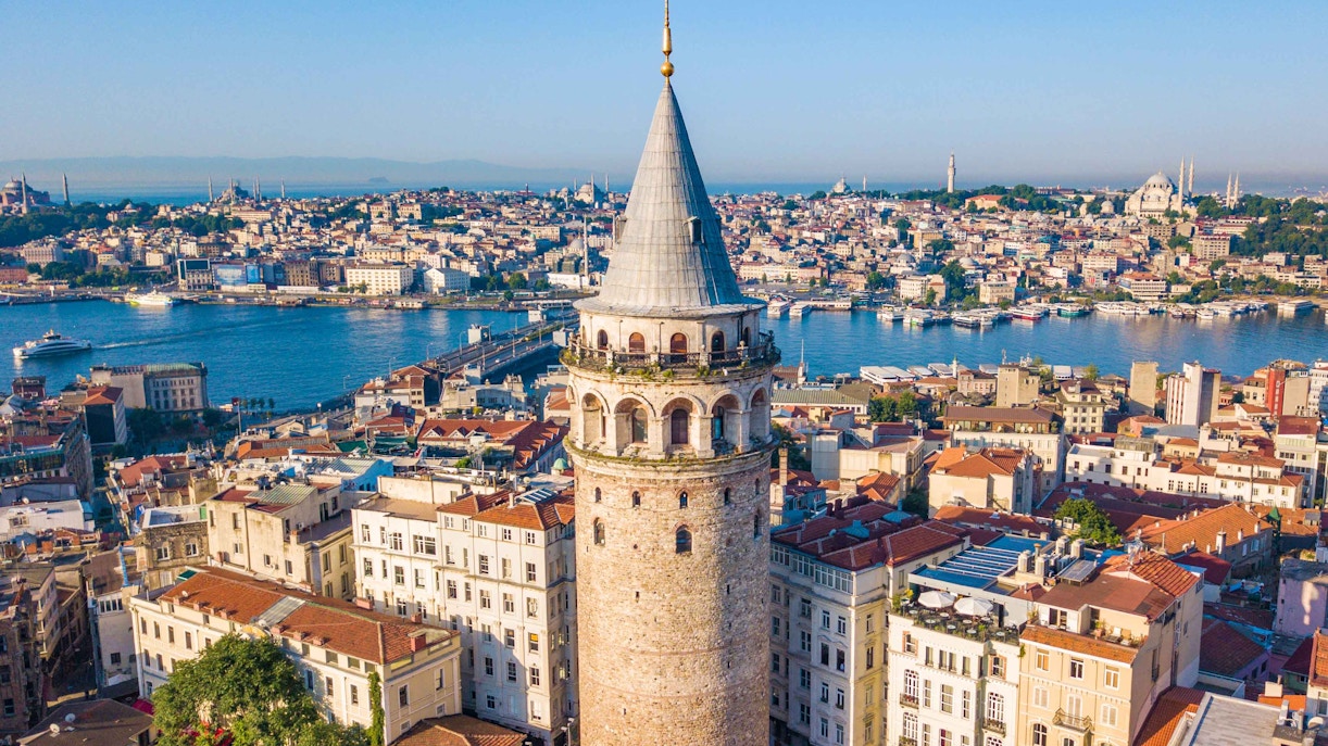 Galata Tower in Istanbul with cityscape view in the background.