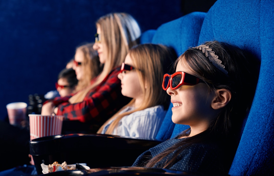 Little girl watching a 4D cinema experience