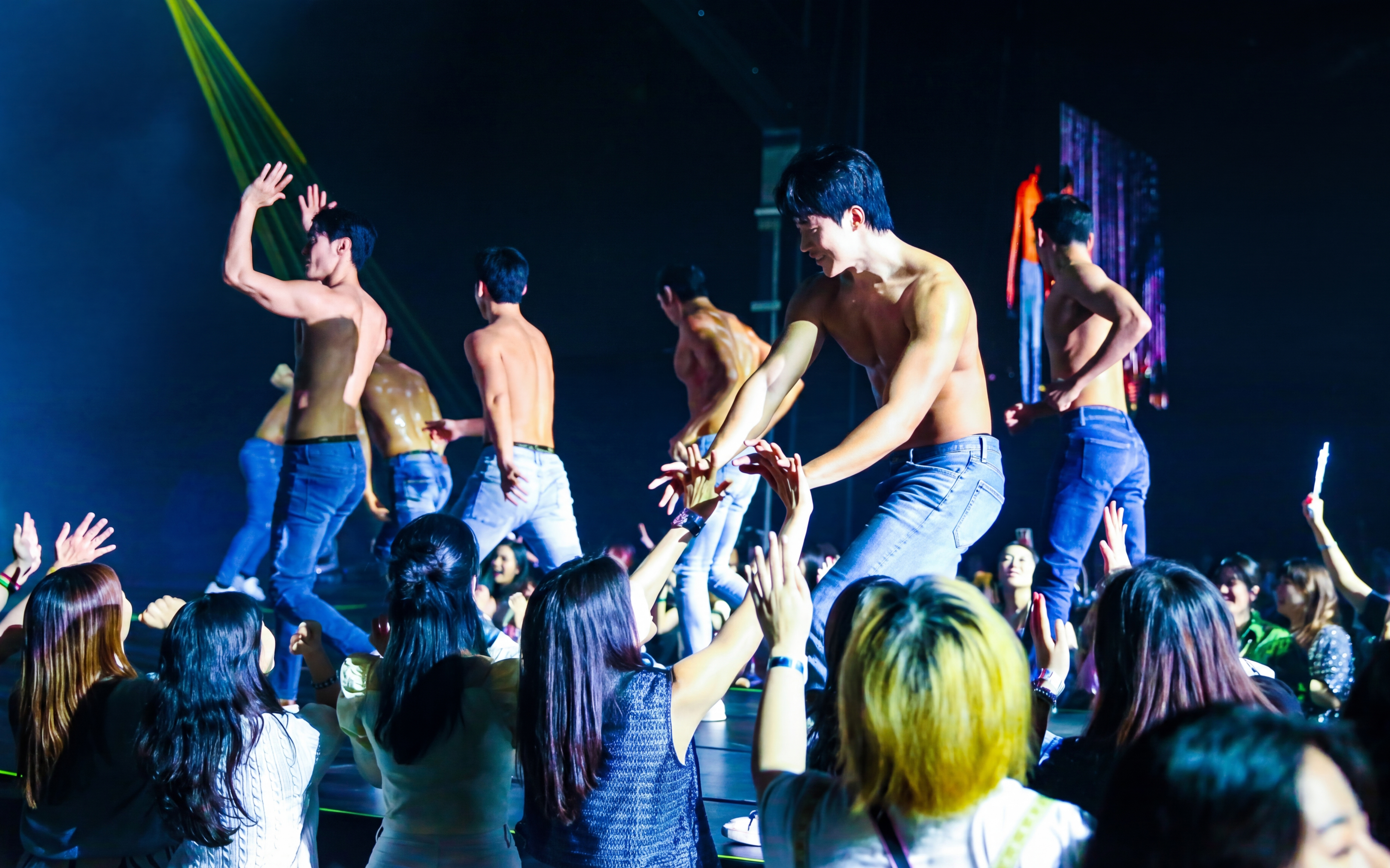 Performers interacting with audience at Wild Wild Show in Korea.