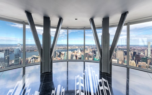 Empire State Building Observatory view of New York City skyline with Hudson River.