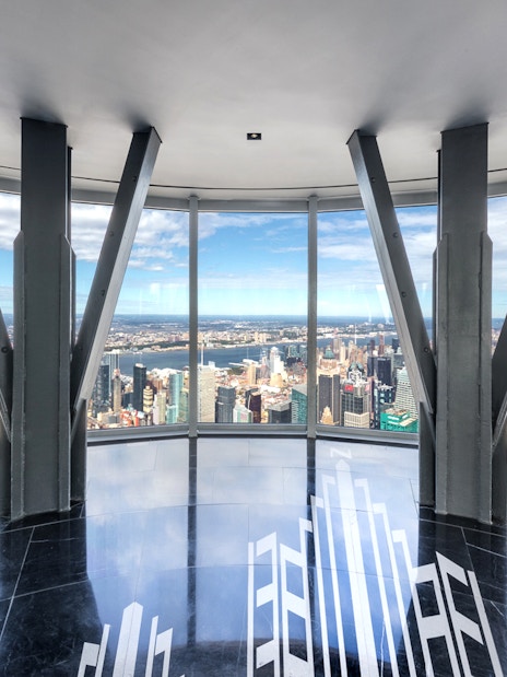 Empire State Building Observatory view of New York City skyline with Hudson River.