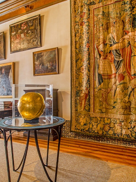 National Palace of Sintra Camarim with tapestries and paintings displayed.