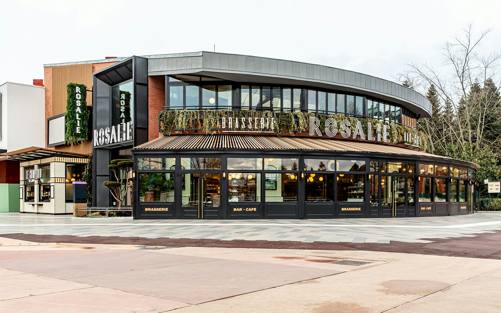 Brasserie Rosalie exterior, a breakfast spot with modern design and greenery.