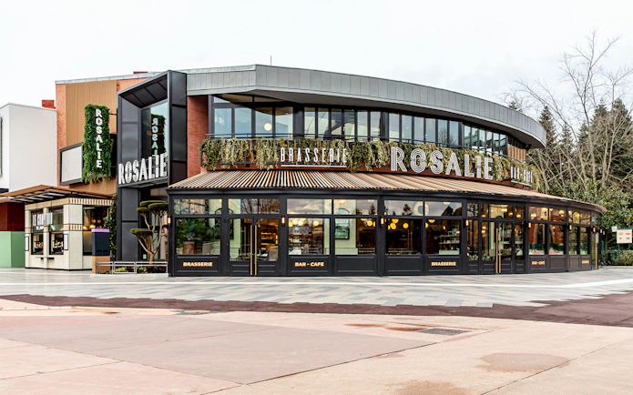 Brasserie Rosalie exterior, a breakfast spot with modern design and greenery.
