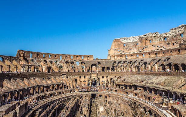 Colosseum arena floor with view of gladiators' entrance in Rome, Italy.