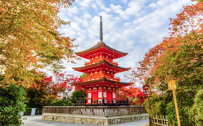 Kiyomizudera Temple pagoda surrounded by autumn foliage on Kyoto guided day trip.