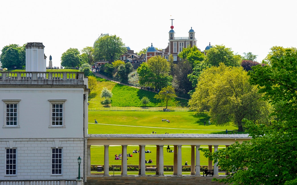 Visitors at Royal Observatory Greenwich, London, exploring the historic site and surrounding park.