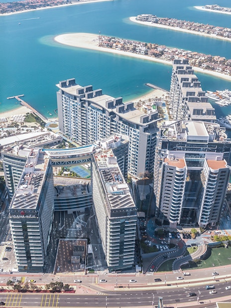 Aerial view of Palm Jumeirah and Dubai Marina from The View at The Palm.