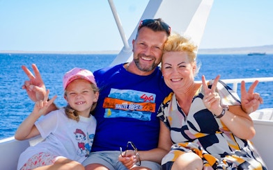 Family enjoying a boat trip on Orange Bay Island, Hurghada.