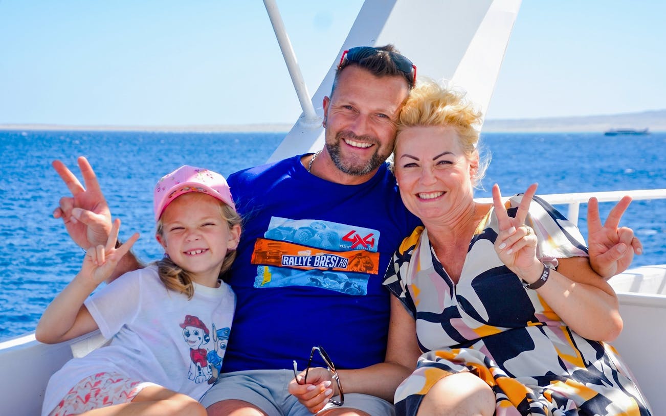 Family enjoying a boat trip on Orange Bay Island, Hurghada.