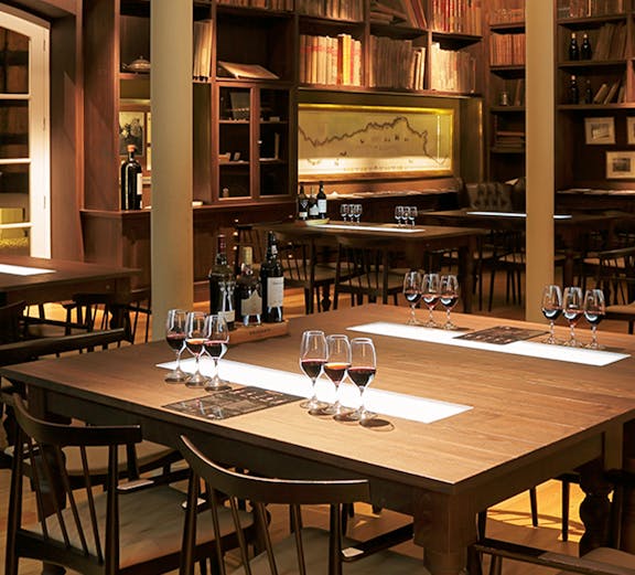 Graham Wine Tasting Experience setup with glasses and bottles in a cozy room.