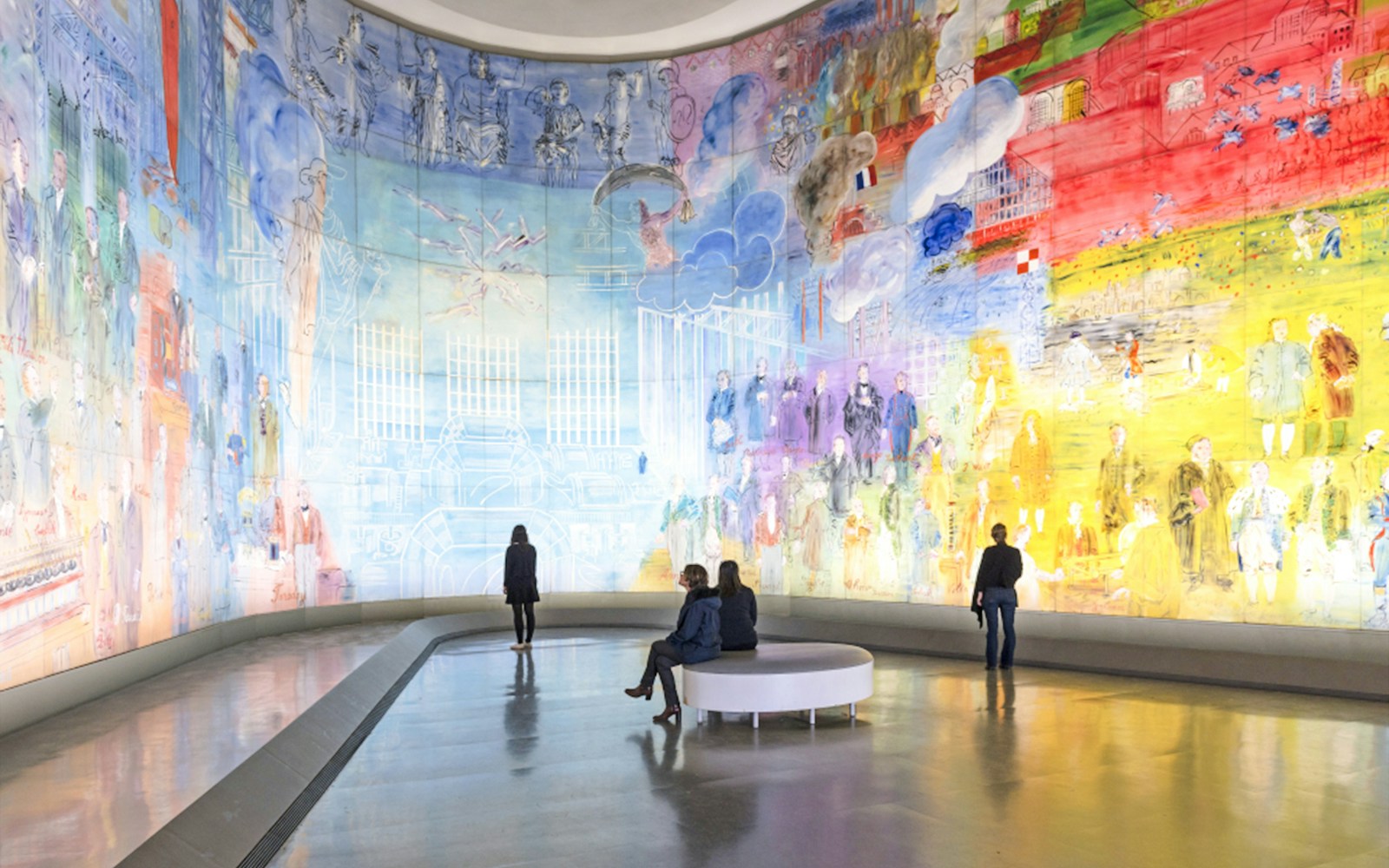 Visitors viewing colorful mural at Museum of Modern Art, Paris, France.