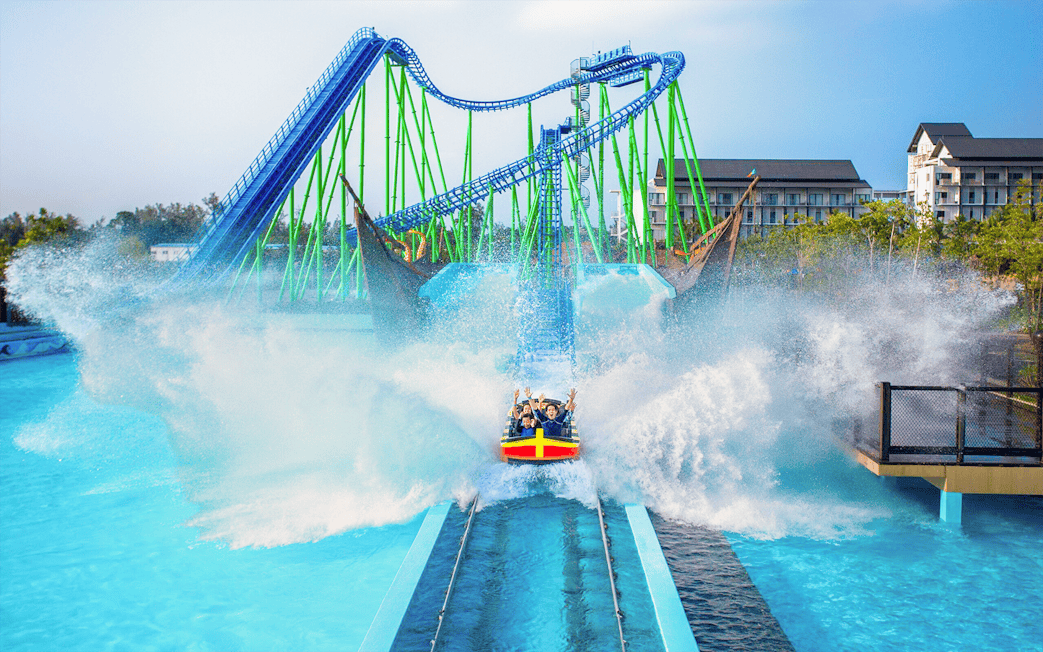 Desaru water coaster splashing at Adventure Waterpark with riders enjoying the thrill.