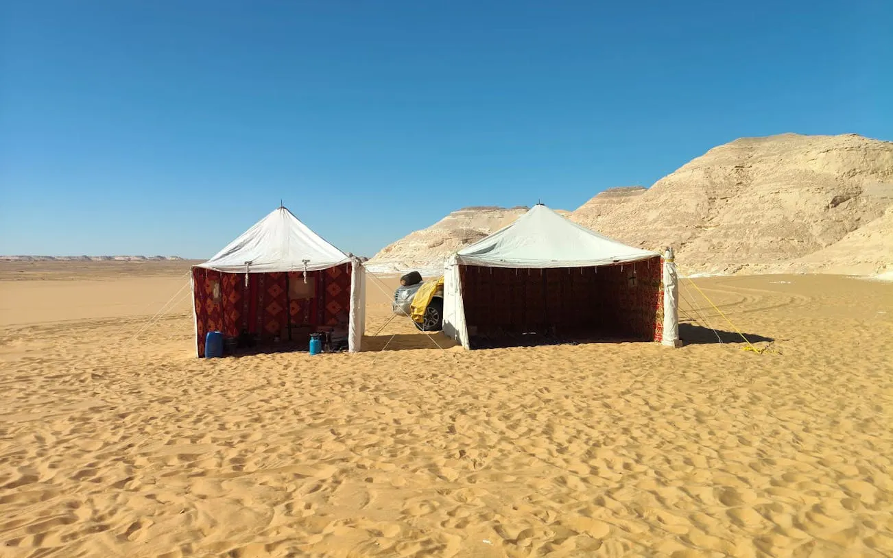 Bedouin tents in the Black and White Desert during a private safari from Cairo.