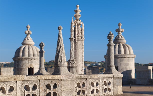 Rooftop view of Belém Tower's ornate turrets in Lisbon, Portugal.