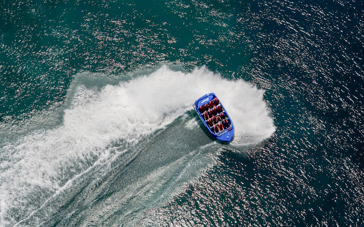 Aerial view of a jet boat making a turn on Huka Falls, New Zealand.