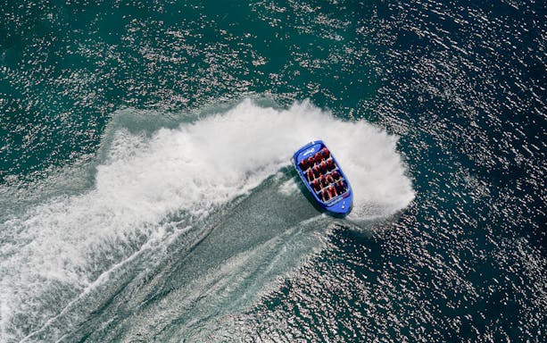 Aerial view of a jet boat making a turn on Huka Falls, New Zealand.
