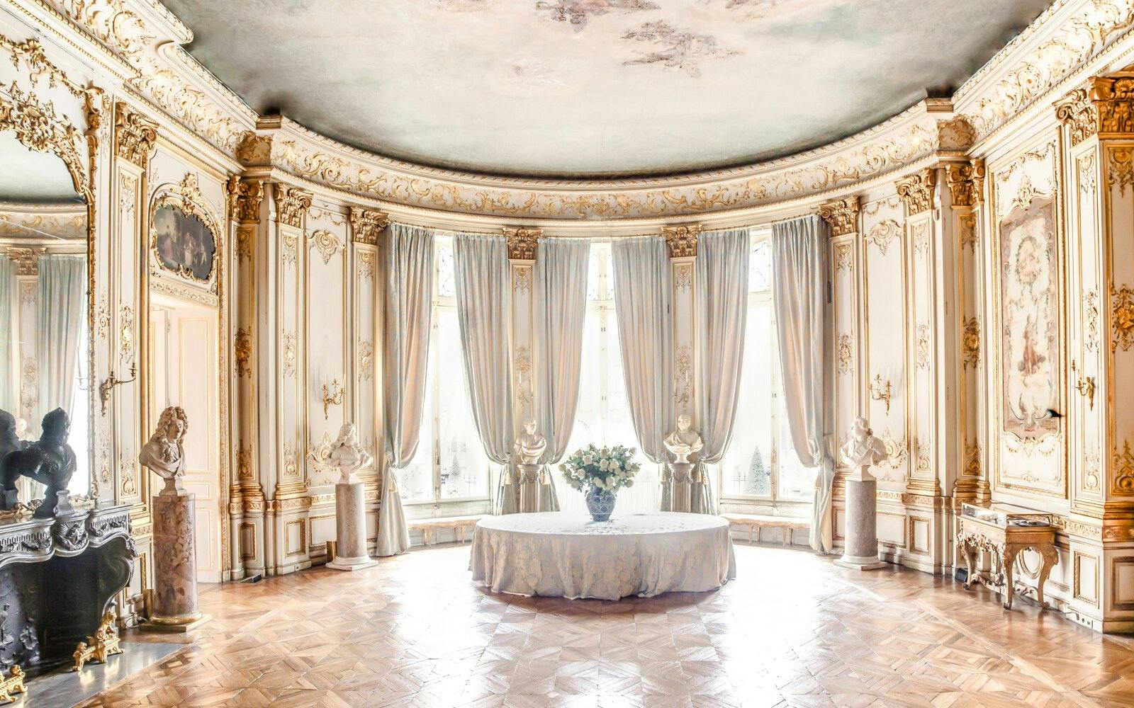 Jacquemart André Museum ornate room with sculptures and elegant drapery.