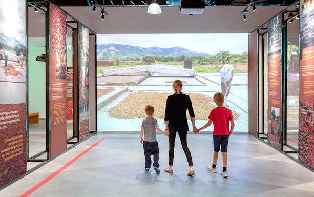 Family exploring museum exhibit in WOW Porto Cultural District.
