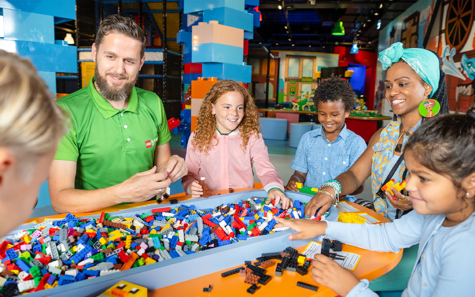 Visitors building with LEGO bricks at LEGO Discovery Centre Hamburg.