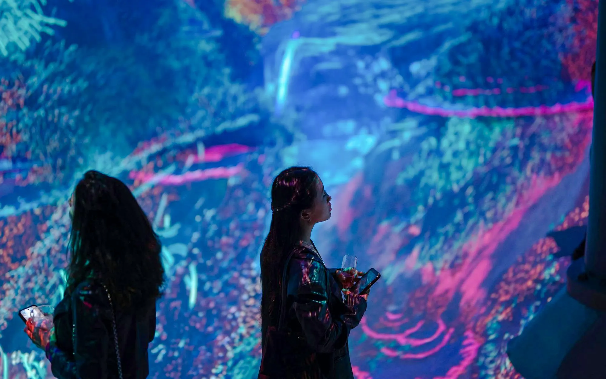 Guests viewing digital art installations at ARTECHOUSE DC.
