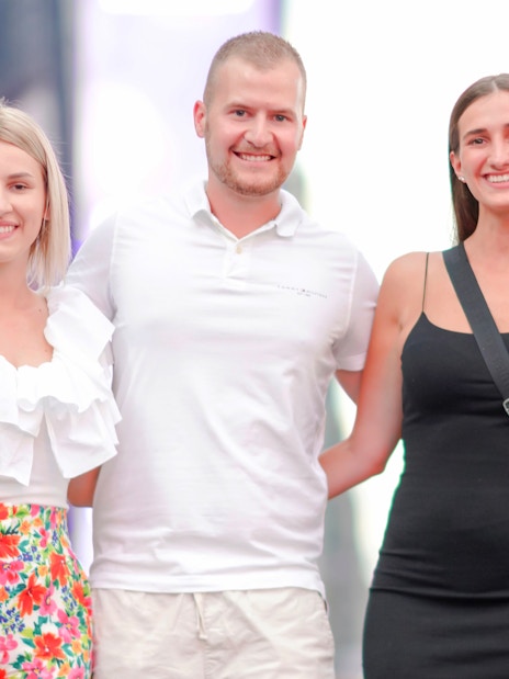 Group posing for a photoshoot in Times Square, NYC.