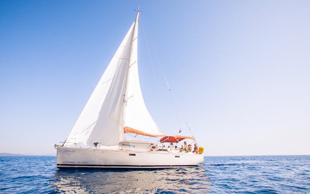 Yacht sailing in Hvar with passengers enjoying a full day tour.