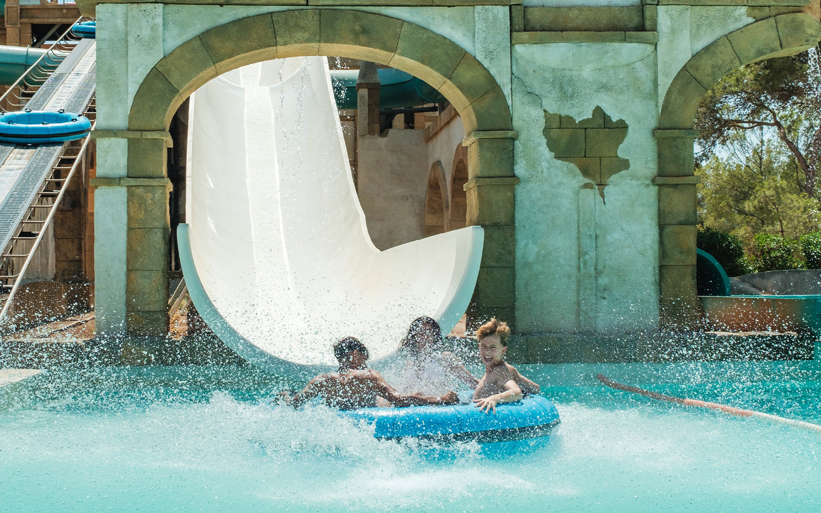 Visitors enjoying a water slide at Misol-Ah Aqualand El Arenal.