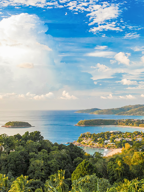 Phuket coastline with lush greenery and ocean view, ideal for ATV and zipline adventure.