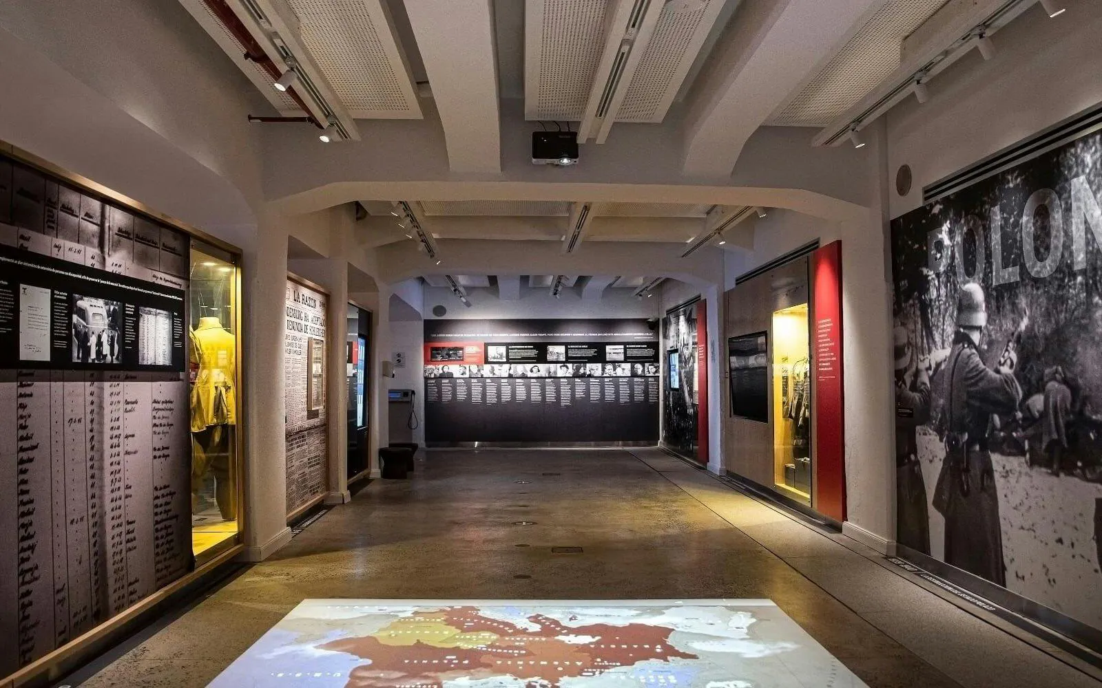 Jewish museum exhibit in Buenos Aires showcasing historical artifacts and photographs.