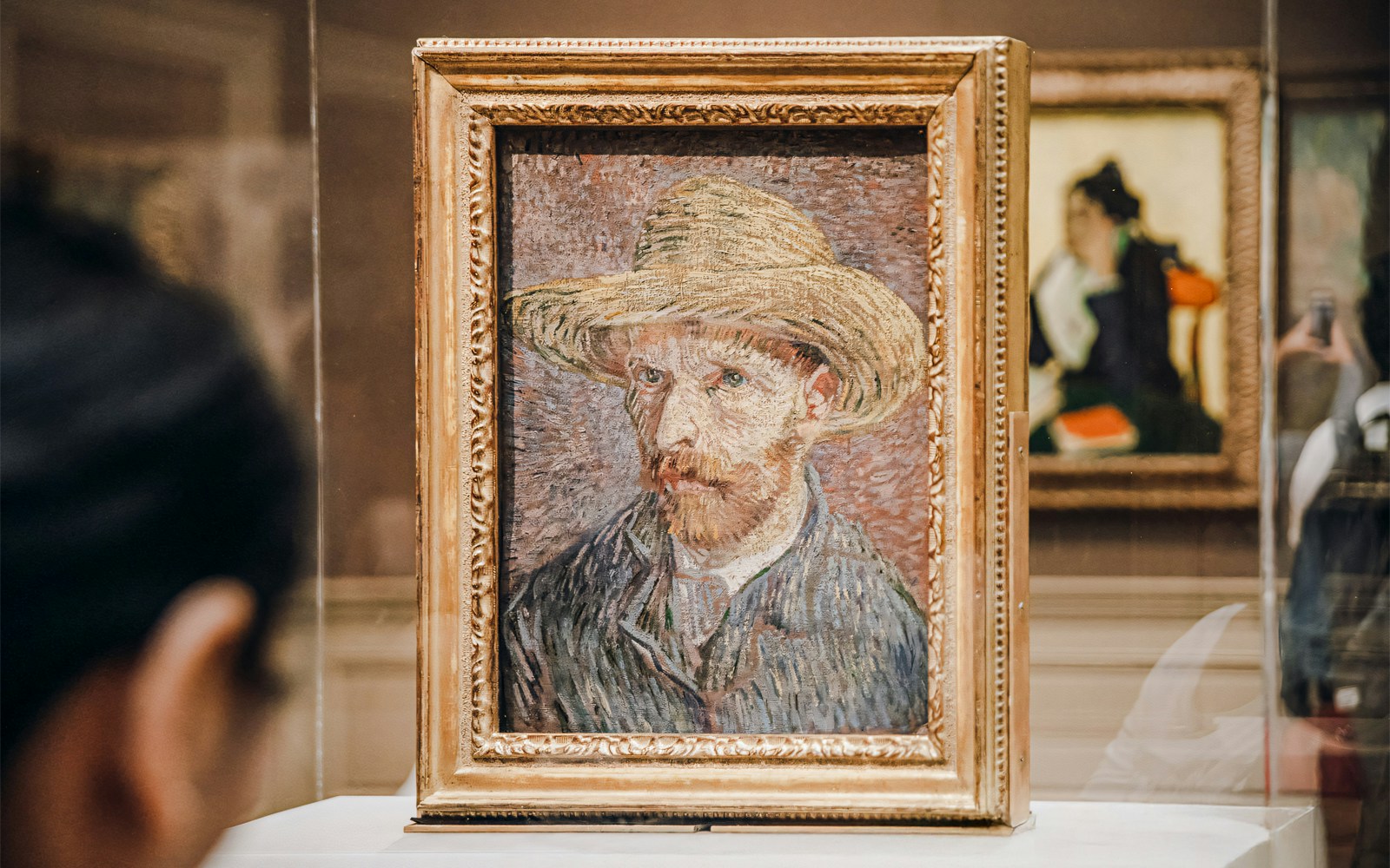 Vincent van Gogh's self-portrait with straw hat in gold frame at Metropolitan Museum of Art, New York.