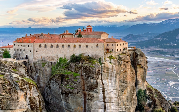 Meteora monastery perched on rock formation, view from 1-day train tour from Athens.