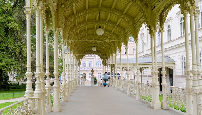 Garden Colonnade in Prague with ornate columns and arched roof.