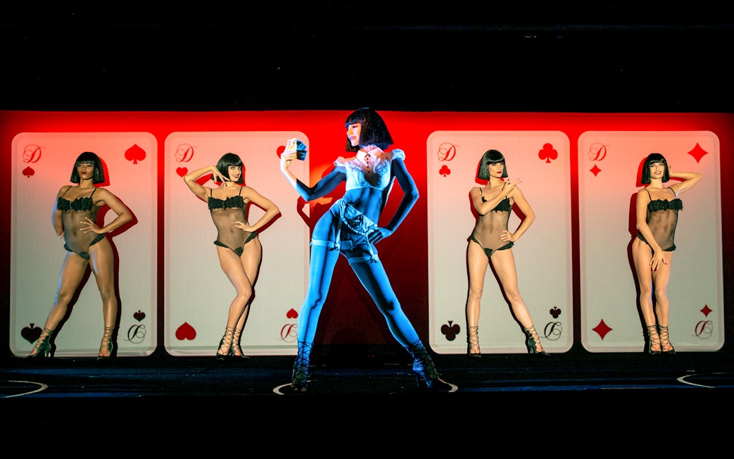 Performer on stage during Crazy Horse Show at Moulin Rouge, Paris.