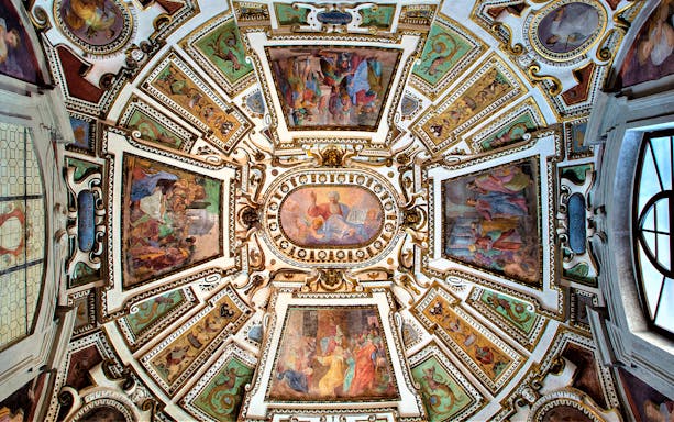 Ceiling frescoes in Volterra Cathedral, Italy, depicting religious scenes and intricate designs.
