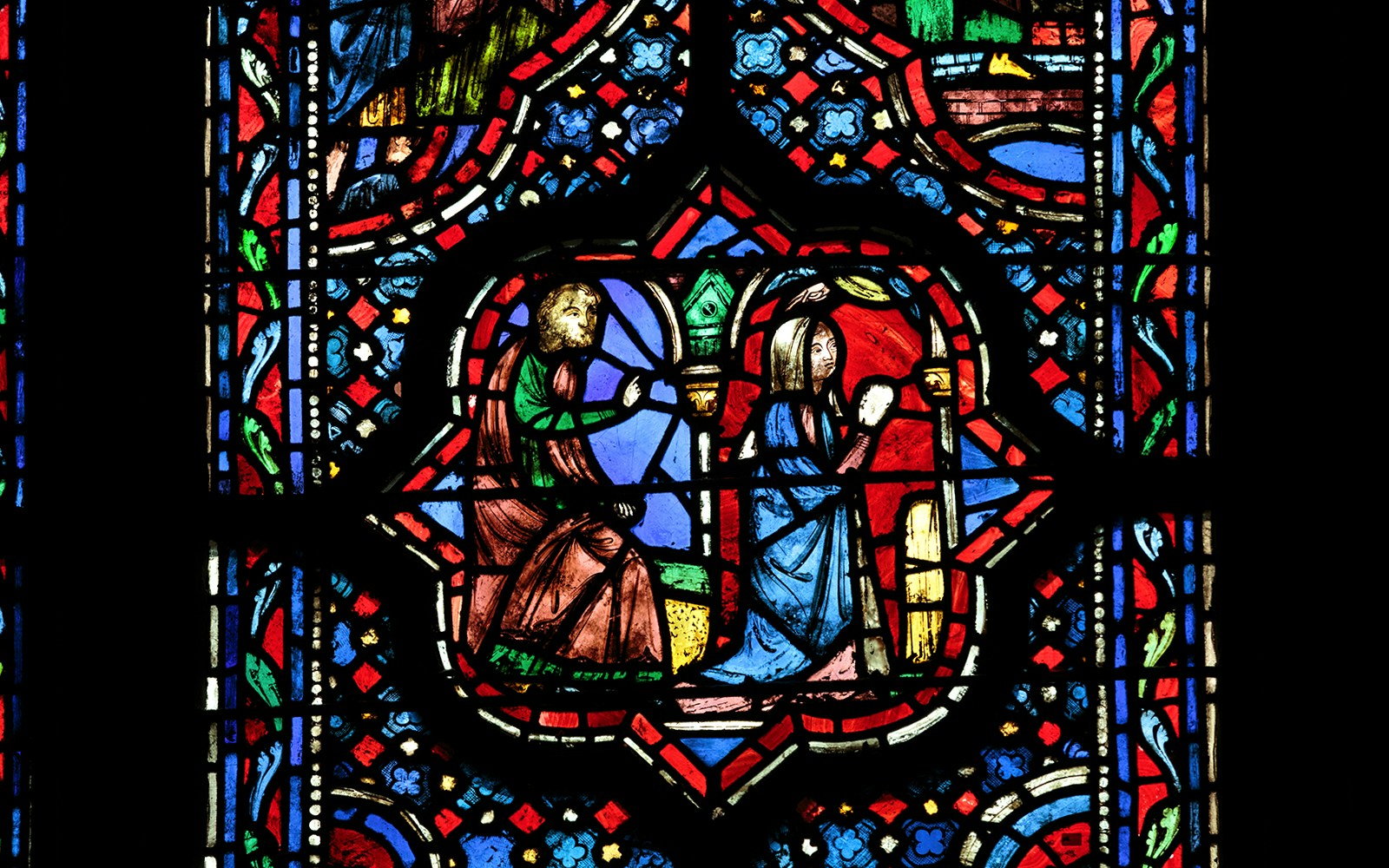 Stained glass windows depicting biblical scenes at Sainte-Chapelle, Paris.