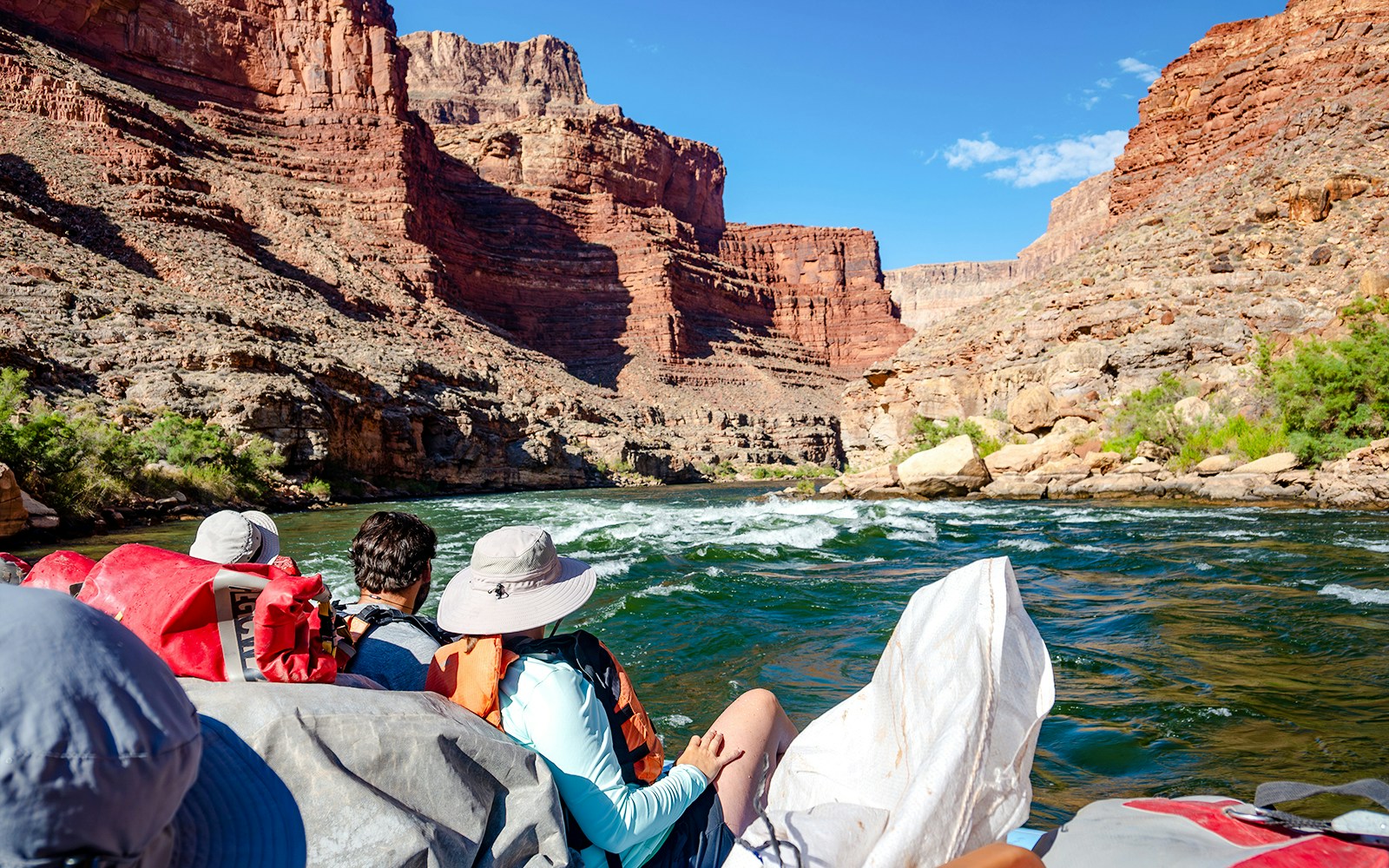 People rafting down the Colorado River in the Grand Canyon.