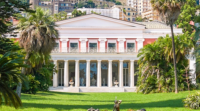 Villa Pignatelli in Naples with lush gardens and cityscape backdrop.