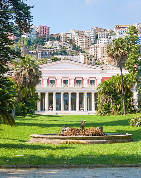 Villa Pignatelli in Naples with lush gardens and cityscape backdrop.