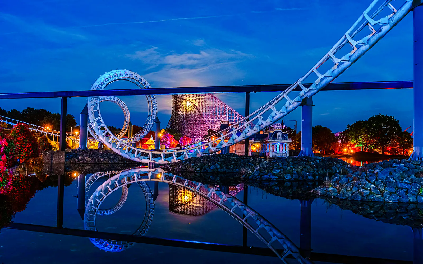 Roller coaster loop at night during Halloween at Heide Park, Germany.