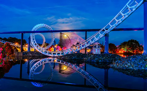 Roller coaster loop at night during Halloween at Heide Park, Germany.