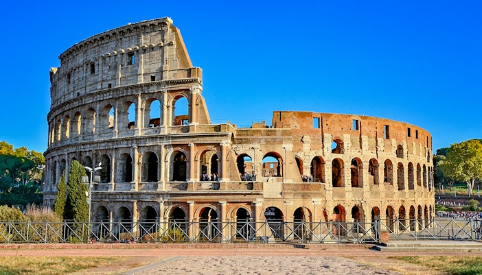 Colosseum in Rome, Italy under a clear blue sky.