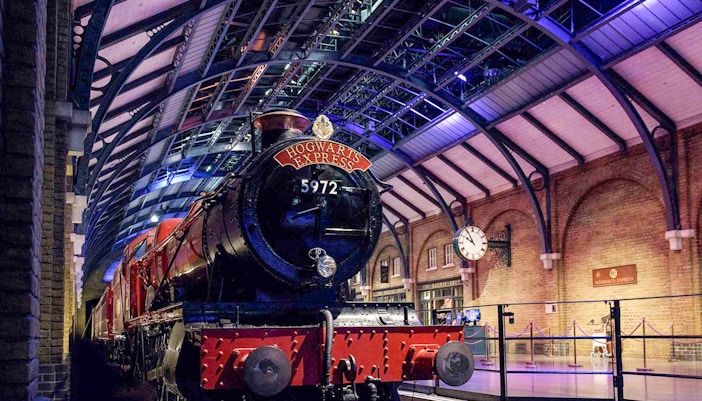 Hogwarts Express train on platform at Harry Potter London tour.