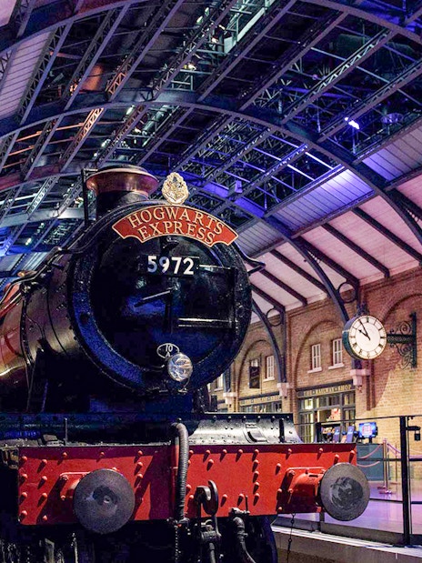 Hogwarts Express train on platform at Harry Potter London tour.